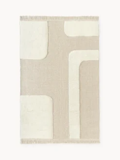Alfombra artesanal con relieve y flecos Laine
