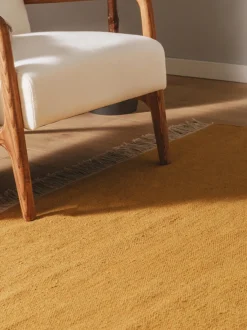 Alfombra artesanal de lana con flecos Liv