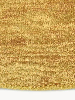 Alfombra redonda artesanal de viscosa Jane