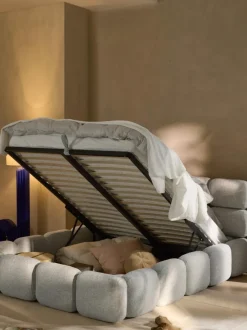 Cama tapizada en tejido bouclé con espacio de almacenamiento Tayla