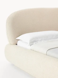 Cama tapizada redondeada en tejido bouclé Alba