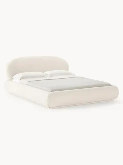 Cama tapizada redondeada en tejido bouclé Alba