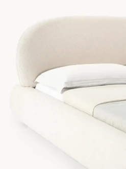 Cama tapizada redondeada en tejido bouclé Alba