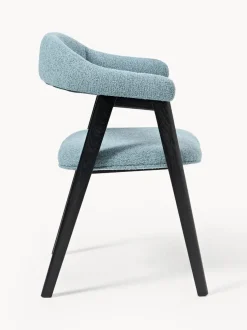 Silla con reposabrazos tapizada en tejido bouclé Nik