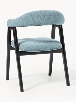 Silla con reposabrazos tapizada en tejido bouclé Nik