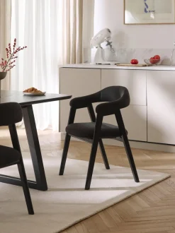 Silla con reposabrazos tapizada Nik