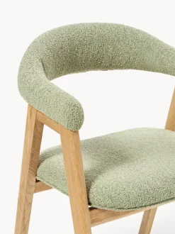 Silla con reposabrazos tapizada en tejido bouclé Nik