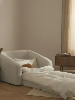 Sillón cama de borreguillo bouclé Eliot