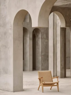 Sillón con asiento y respaldo tejidos a mano CH25