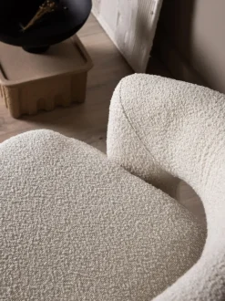 Sillón giratorio en tejido bouclé Laurel