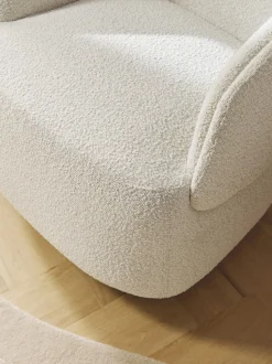 Sillón tapizado en tejido bouclé Irene
