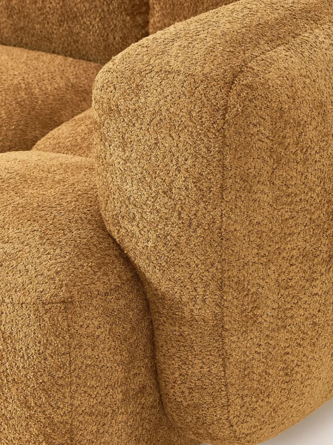 Sofá modular de borreguillo bouclé con reposapiés izquierdo/derecho Tayla (3 plazas)