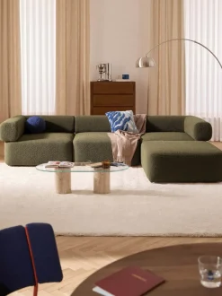Sofá modular en tejido bouclé Anton (4 plazas), con reposapiés (izquierda/derecha)