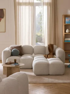 Sofá modular en tejido bouclé con reposapiés Tayla (3 plazas)