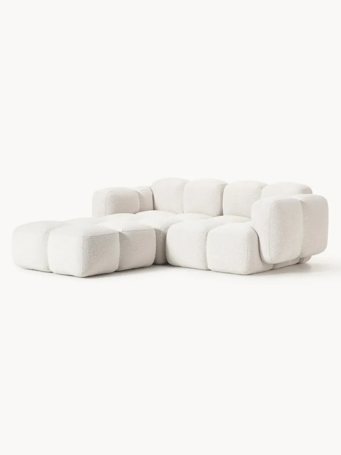 Sofá modular en tejido bouclé con reposapiés Tayla (3 plazas)