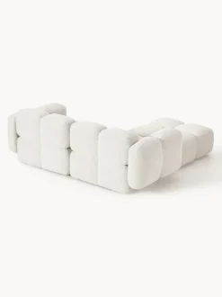 Sofá modular en tejido bouclé con reposapiés Tayla (3 plazas)