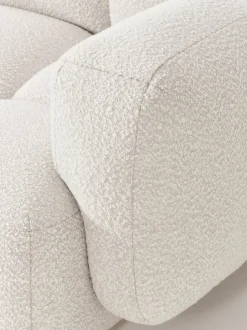 Sofá modular en tejido bouclé con reposapiés Tayla (3 plazas)