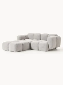Sofá modular en tejido bouclé con reposapiés Tayla (3 plazas)
