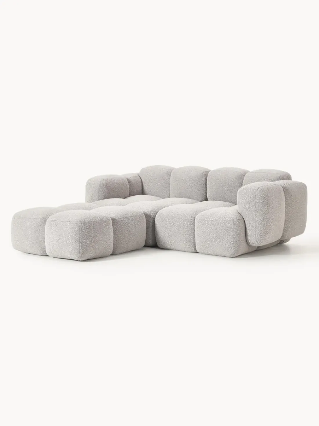 Sofá modular en tejido bouclé con reposapiés Tayla (3 plazas)