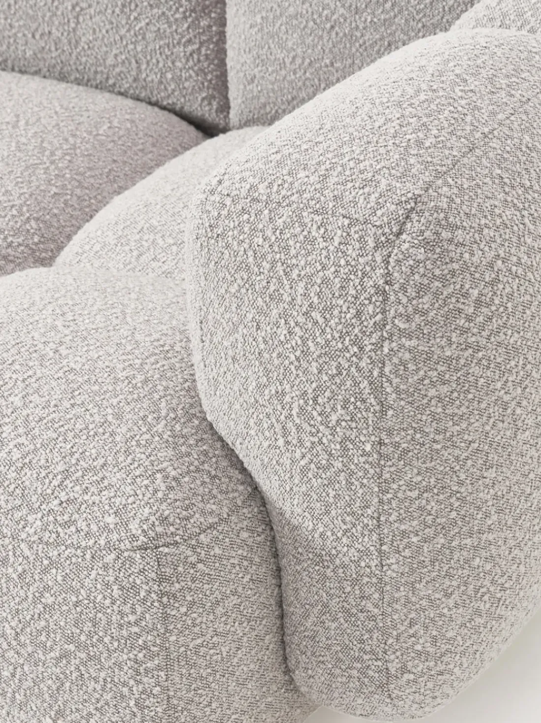 Sofá modular en tejido bouclé con reposapiés Tayla (3 plazas)