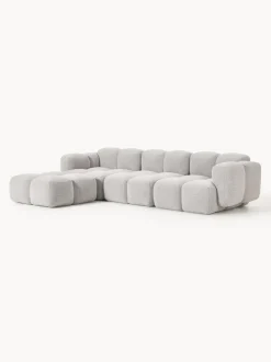 Sofá modular en tejido bouclé con reposapiés Tayla (4 plazas)