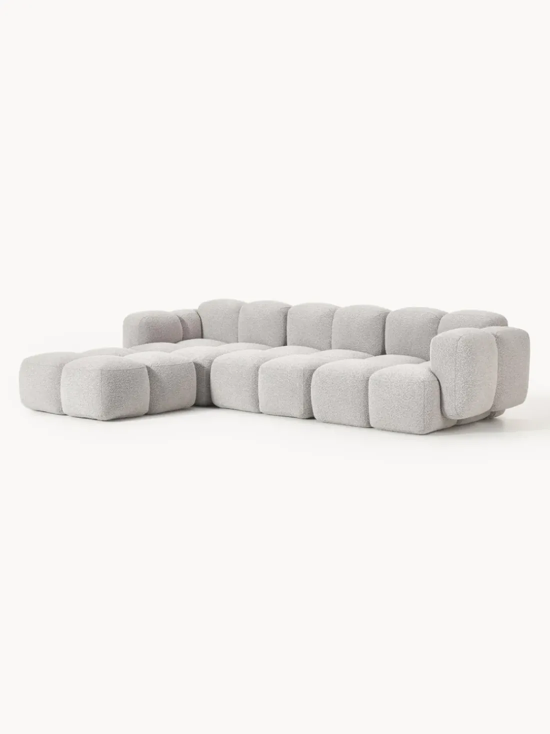 Sofá modular en tejido bouclé con reposapiés Tayla (4 plazas)