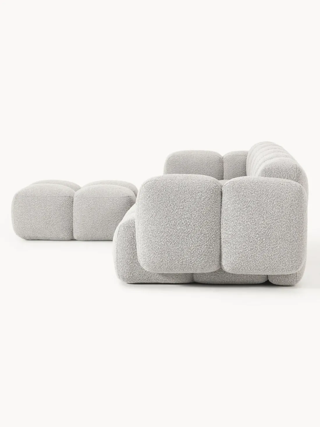 Sofá modular en tejido bouclé con reposapiés Tayla (4 plazas)
