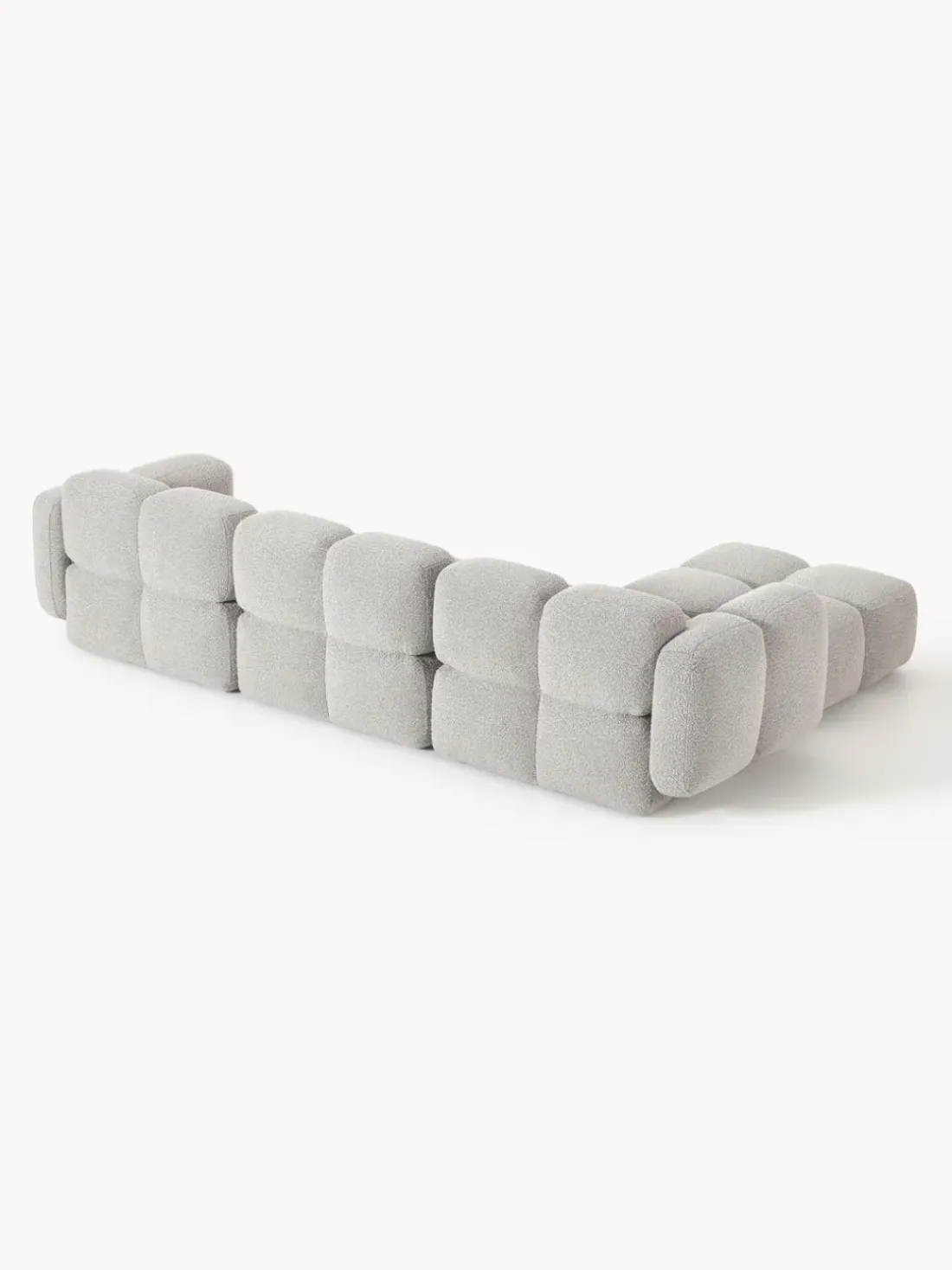 Sofá modular en tejido bouclé con reposapiés Tayla (4 plazas)