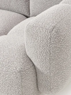 Sofá modular en tejido bouclé con reposapiés Tayla (4 plazas)