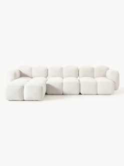 Sofá modular en tejido bouclé con reposapiés Tayla (4 plazas)
