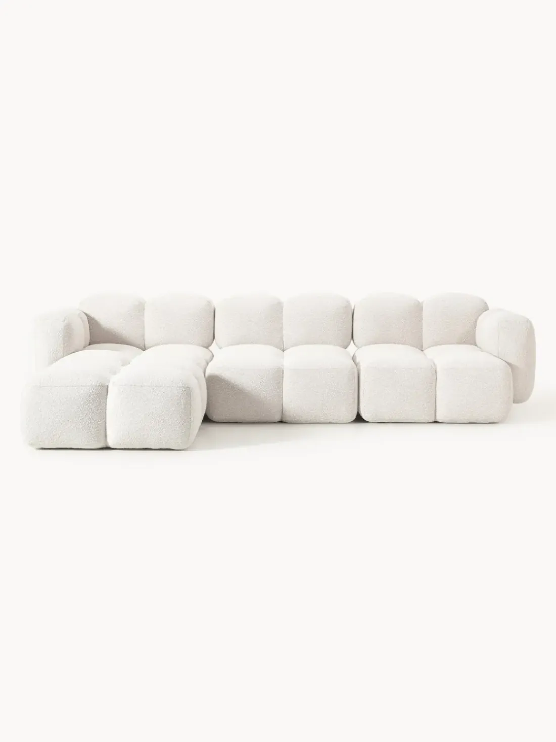 Sofá modular en tejido bouclé con reposapiés Tayla (4 plazas)