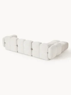 Sofá modular en tejido bouclé con reposapiés Tayla (4 plazas)