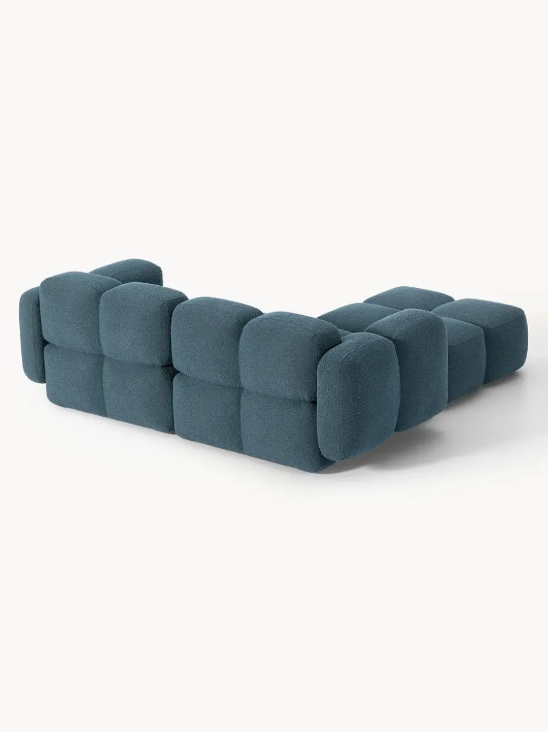 Sofá modular en tejido bouclé con reposapiés Tayla (3 plazas)