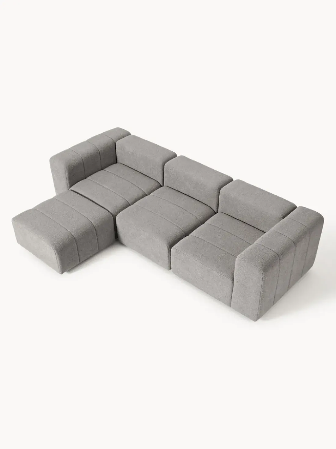 Sofá modular en tejido bouclé con reposapiés izquierdo/derecho Lena (4 plazas)